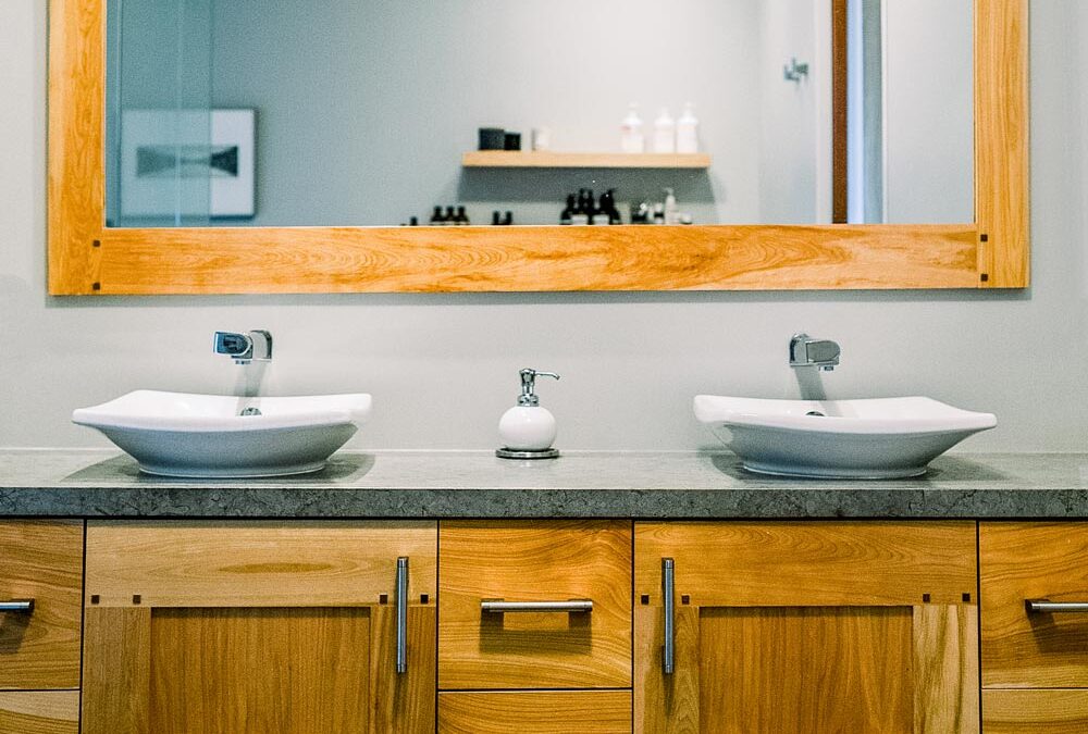 Bathroom with sinks, mirror and closets